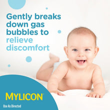 Infants' Mylicon gas relief drops with smiling newborn