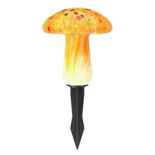 Yellow mushroom solar light with speckled cap, white glow, and black pointed stake