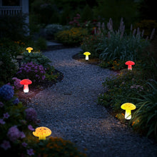 Solar mushroom landscape lights along garden path with red and yellow glowing caps