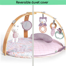 Reversible baby activity gym with plush toys and two-sided quilted play mat surface
