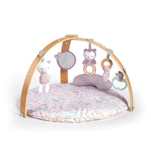 Reversible baby activity gym with wooden arch and hanging plush toys over floral play mat
