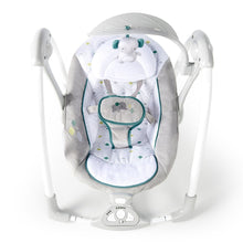 Gray portable vibrating baby swing top view with arched canopy and plush seat toy