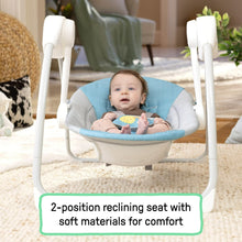 Portable baby swing with canopy, teal and gray seat, baby reclining inside.