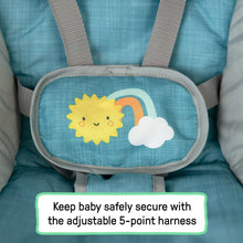 Close-up of teal front toy panel with sun and cloud applique on the seat.