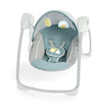 Portable baby swing with teal canopy, gray seat, and hanging toy bar.