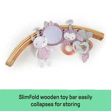 Baby activity gym arch with multiple plush hanging toys and a mirrored circular toy