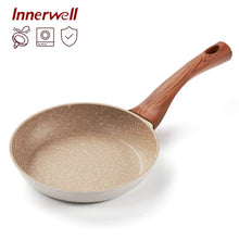 Nonstick frying pan with speckled beige interior and dark wood handle, 8-inch