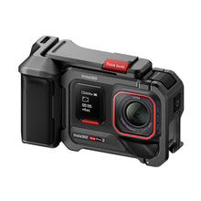 Compact action camera with front lens and red-accent buttons on dark body
