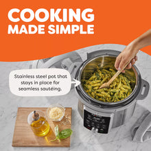 Electric pressure cooker with stainless inner pot holding cooked food
