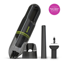 Cordless handheld vacuum in dark green with clear dust cup and extension accessories