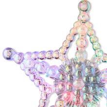 Iridescent beaded star LED tree topper with multicolor bulbs, close-up