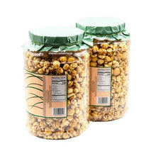 Caramel popcorn crunch in two clear jars with green lids, front and back label view