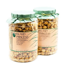 Popcorn crunch snack in two glass jars with green caps, caramel-coated crunchy kernels