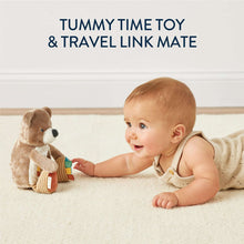 Baby playing with bear sensory tummy time toy with mirror panel