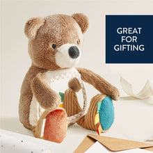 Plush bear sensory toy showing mirror panel and textured fabric hands