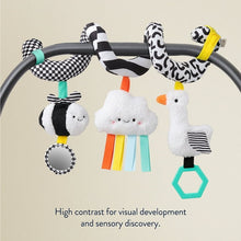 High-contrast plush stroller toy with hanging animals and teal hex teether