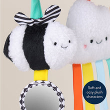 Close-up plush insect and cloud toy with striped fabric and rainbow ribbon