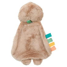 Plush sloth toy, tan fleece body with teal ribbon tags on arms and legs