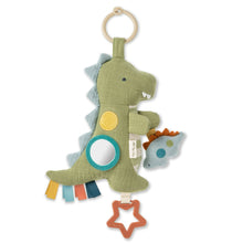 Itzy Ritzy Bitzy traveler dino car seat toy in olive green with rings and star clip