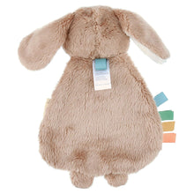 Taupe plush bunny lovey with mint heart bib, colored ribbon loops, and hanging tag