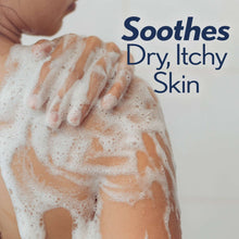 Body wash lather on hands, white foam bubbles over skin