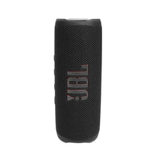 Black JBL Flip 6 portable speaker with fabric grille and vertical JBL logo.