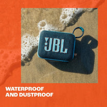 Blue JBL portable Bluetooth speaker with fabric grille and JBL logo