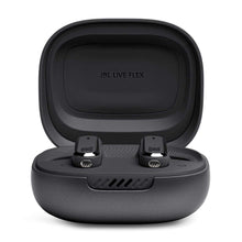 Black wireless earbuds seated in open charging case, top view
