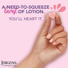 Hand squeezing a pink heart-shaped lotion burst