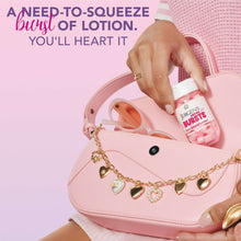 Hand holding a Jergens Lotion Bursts jar beside a pink handbag