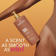 Jergens Warm Amber body lotion bottle with gold pump, held near arm