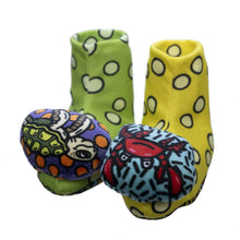 Sensory rattle socks with green and yellow plush, blue and red patterned toe rattles