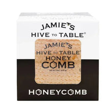 Honeycomb honey brick inside clear plastic package with amber hex-cell surface