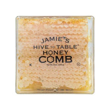 Honeycomb honey tray in clear plastic showing golden hexagon cell pattern