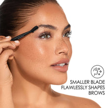 Brow touch up razor held at eyebrow line for shaping