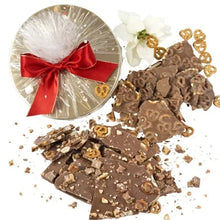 Chocolate bark duo tin with red ribbon, milk chocolate bark pieces and crumbs