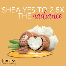 Sliced shea nuts with white shea butter and green leaves