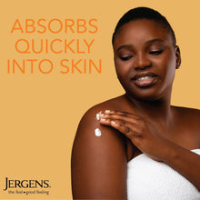 Body lotion applied to chest area, hands spreading white cream