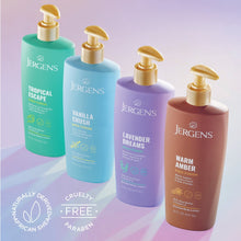 Assorted scented body lotion bottles with gold pumps in teal, purple, and brown