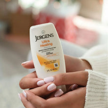 Jergens Ultra Healing moisturizer tube held in a person’s hand