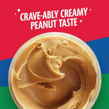 Opened peanut butter jar showing creamy peanut spread inside