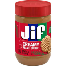 Peanut butter jar with red screw-top lid and creamy brown contents