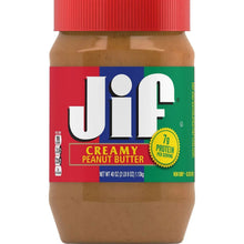 Creamy peanut butter jar with red lid, beige peanut butter filling, and label details
