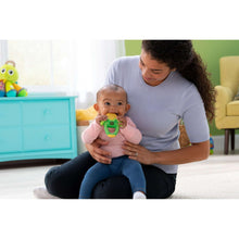 Corn teether toy in baby’s grip, green and yellow