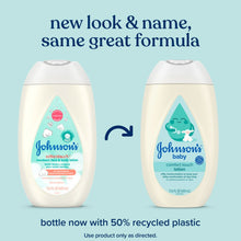 Two cream baby lotion bottles with comfort touch labels, 13.6 fl oz each