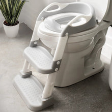 Gray toddler potty training seat with splash guard and two-step ladder