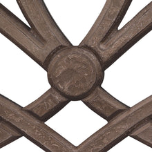 Bronze-toned mirror frame centerpiece with circular medallion and cross bars