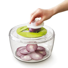 Clear salad chopper bowl with green slicing insert and white lid