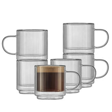 Stackable fluted double-wall glass mug set: clear mugs with one amber mug in front