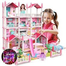 Pink multi-level dollhouse playset with balconies, stairs, and two doll figures